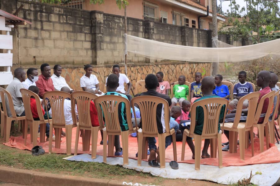 Children participating in a guided group play and recovery session at RMFSL in Kampala, Uganda